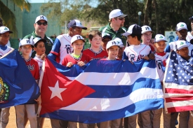 Holding the U.S. and Cuban flags, along with the Vermont state flag, side-by-side following the game against Playa.
