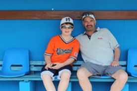 Vermonters Ozzie and Dave Kost pose for a photo inside the Havana Industriales dugout at the Estadio Latinoamericano.
