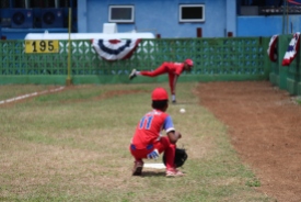 A pitcher for the Cuban team Marianao warms up in the bullpen prior to the game against Vermont.