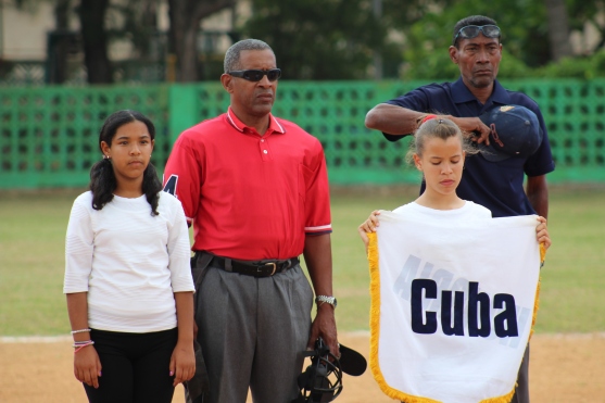 Cuban umpires stand to respect the playing of the U.S. National Anthem.