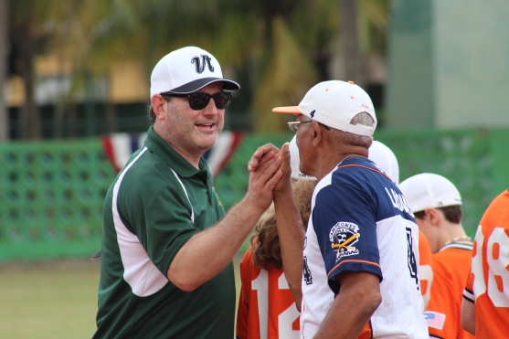 Vermont coach Tom Simon shakes hands with Marianao coach Leonis Acosta before the game.