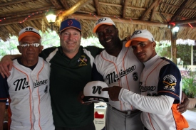 Vermont coach Tom Simon (second from left) with the coaching staff of the Cuban team Marianao.